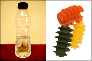 Fun activities for toddlers: water bottle and uncooked colorful pasta.