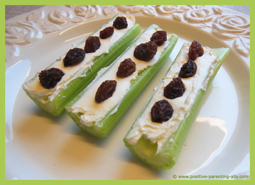 Healthy snack for kids: ants on a log with celery, cream cheese and raisins.