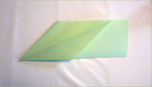 Origami airplane step 4 in paper crafts for kids