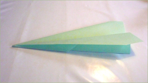 Origami airplane step 6 in paper crafts for kids