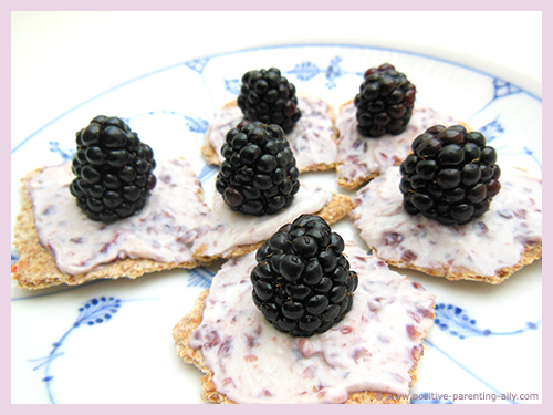 Healthy kids and toddler snack: cream cheese, blueberries and cracker.