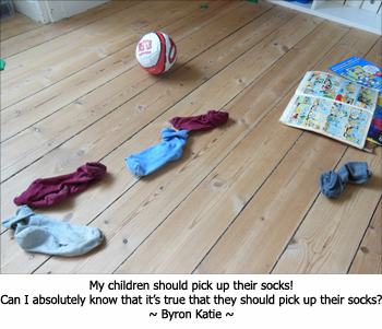 Picture of children's socks on the floor. Byron Katie questioning whether her kids should pick them up.