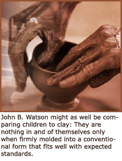 photo of hands molding clay making a cup