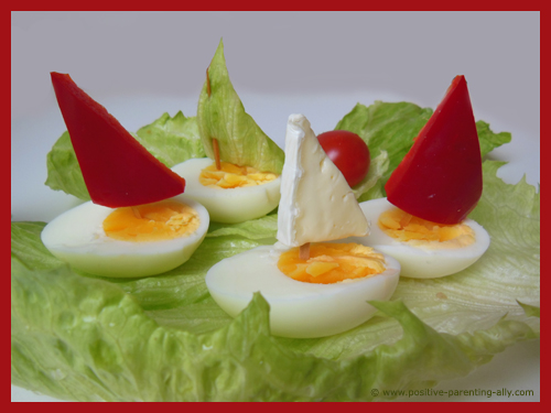 Fancy egg boats with sail for kids as a quick, easy and healthy after school snack.