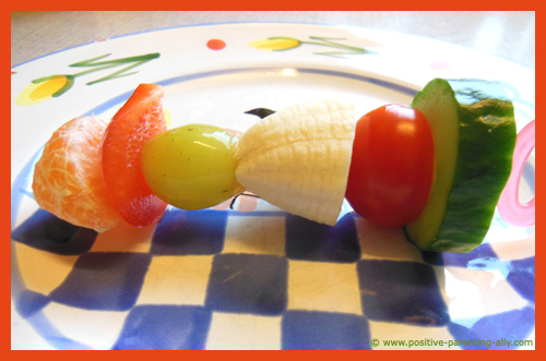 Raw fruit and vegetable kebab for kids as a healthy snack.