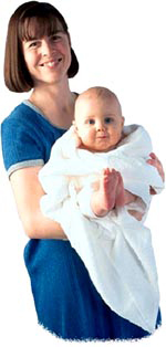 Baby safely held by his mother all cuddled up in a white towel.