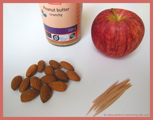Ingredients for almondy apple boats: Apple, almonds and peanut butter.