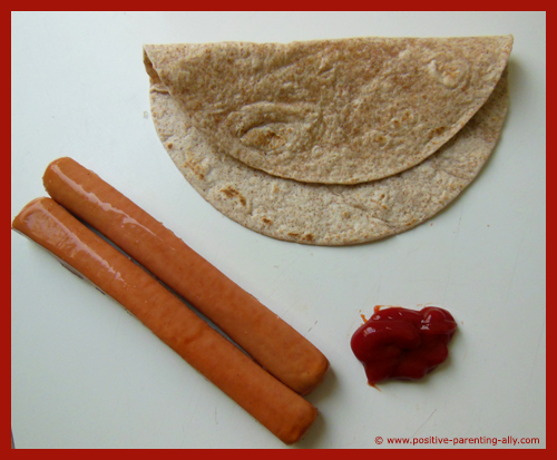 Ingredients for Halloween fingers: tortilla, sausages and ketchup
