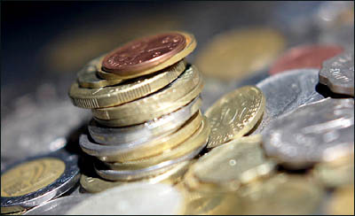 Having fun with counting coins: Big pile of coins.