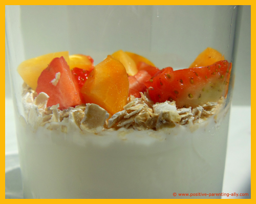 Fruit and oatmeal in plain yogurt. An easy and quick kids snack. 