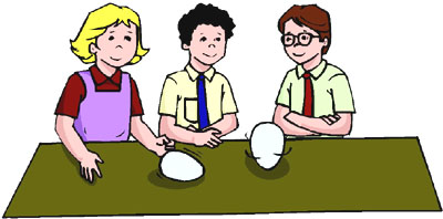 Spinning a raw and a cooked egg as one of the fun science projects for kids to do in the kitchen at home.