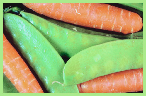 Fruit and vegetables are the main ingredients in quick snacks for kids: Picture of carrots and peas.