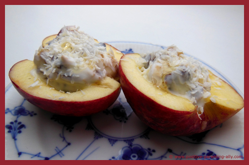 Healthy snack ideas for kids: Stuffed apples with yoghurt, nuts and raisins.
