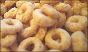 Fun indoor toddler games: Putting cereal cheerios on a string. 