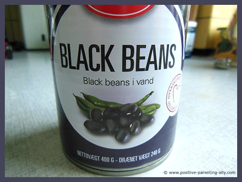 Can of black beans in water for crispy healthy snacks.