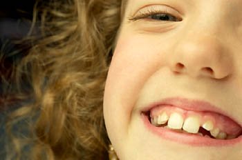 Fun math activities can be a great way to learn and have a blast at the same time: Girl laughing.