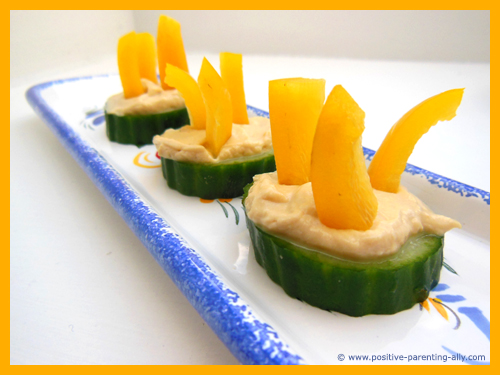 Cucumber hummus discs as an easy snacks for kids.