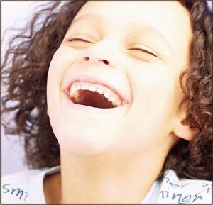 Little girl laughing having a great time.