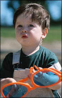 Fun activities for toddlers: Little toddler boy with big sunglasses.