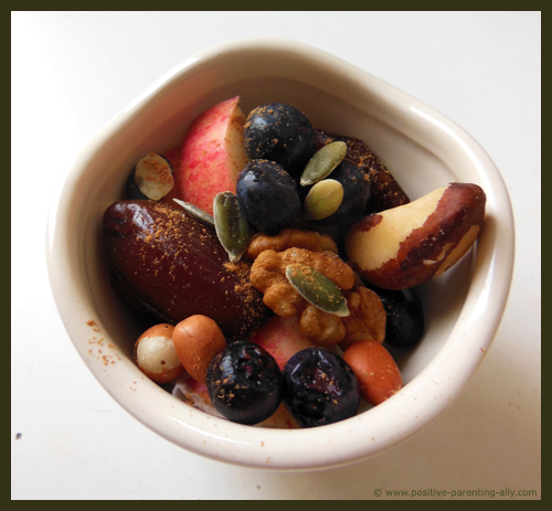 Healthy Halloween snacks for kids: a mix of nuts, berries, fruits and seeds. 