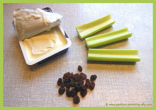 Ingredients for ants on a log with celery, cream cheese and raisins.