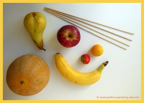 Fruit ingredients for a fruit kebab: melon, pear, apple, strawberry, apricot and banana.