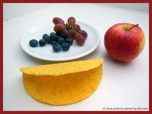 Ingredients for the fruit tortilla: tortilla shell, apple, blueberries and grapes.