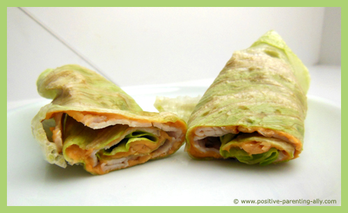 Turkey salad rolls with peanut butter as healthy easy snacks for kids.