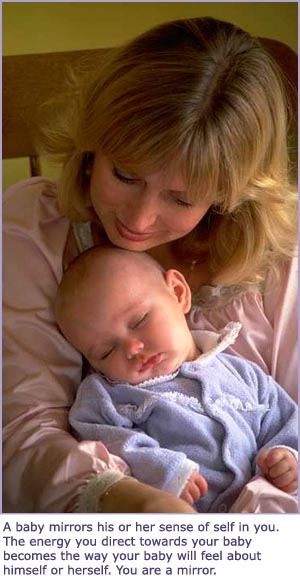 Cute picture of mom holding sleeping baby