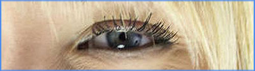 Picture of blond woman with blue eyes. Close up of eye.