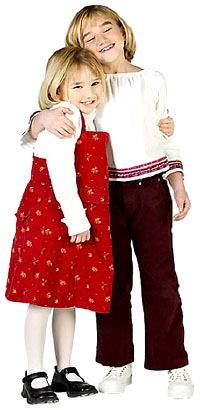 The child development stage of growing empahy according to Flavell: Two girls hugging. The child development stage of growing empahy according to Flavell: Two girls hugging.