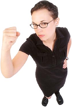 Angry looking woman with raised clenched fist! A representation of control.