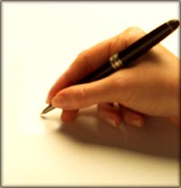 Parenting style quiz: Hand with a pencil writing on paper.
