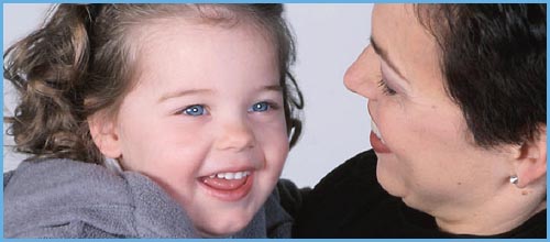 Positive parenting! Work with you kid's level of consciousness. Picture of mother looking at her happy girl toddler