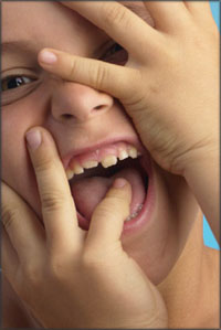 Close up of boy laughing.