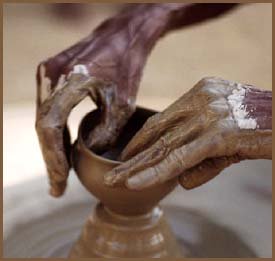 Hands molding a cup of clay. How a narcissist would mold their kids.