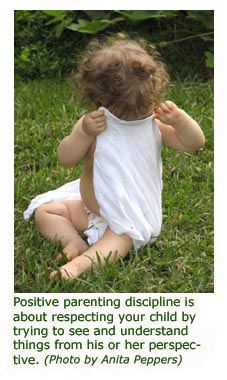 Cute toddler picture, girl looking into a bag - photo by Anita Peppers