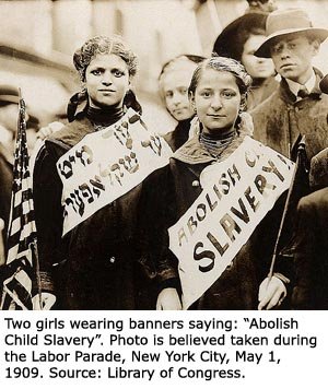 Old photo of the child labor parade. Two girls with banners: abadon child slavery!