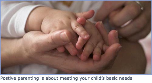 Beautiful picture of baby hands and mother's hand folding in lap.