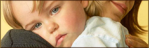 Little girl seeking comfort and hugs at mom's shoulder!