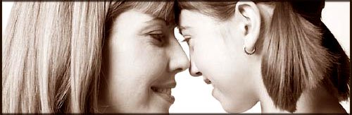 The power of positive parenting is using the mirror effect. What you give is what you get. Picture of happy mother smiling at her daughter. Looking each other in the eyes.